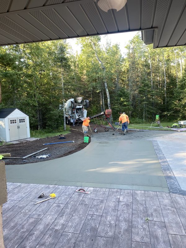 Fresh driveway concrete pour in progress
