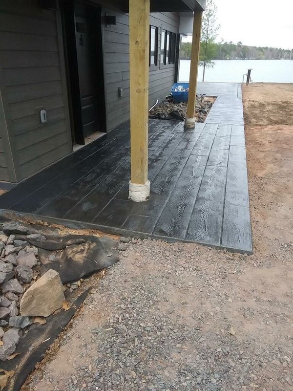 Black wood-plank stamped walkway