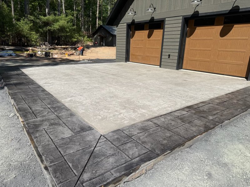 Fully stamped concrete driveway apron with charcoal stamped border